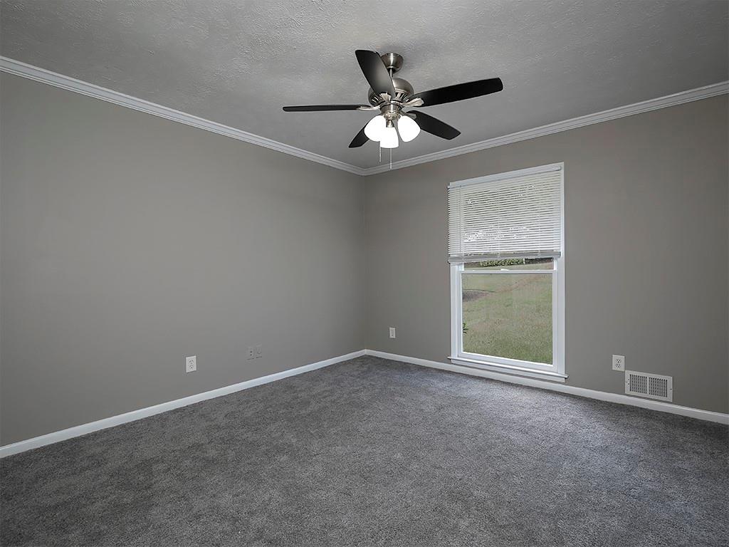581 Autumn Lane Marietta, GA 30068 - Photo 19 of 28 an empty room with a window and a fan