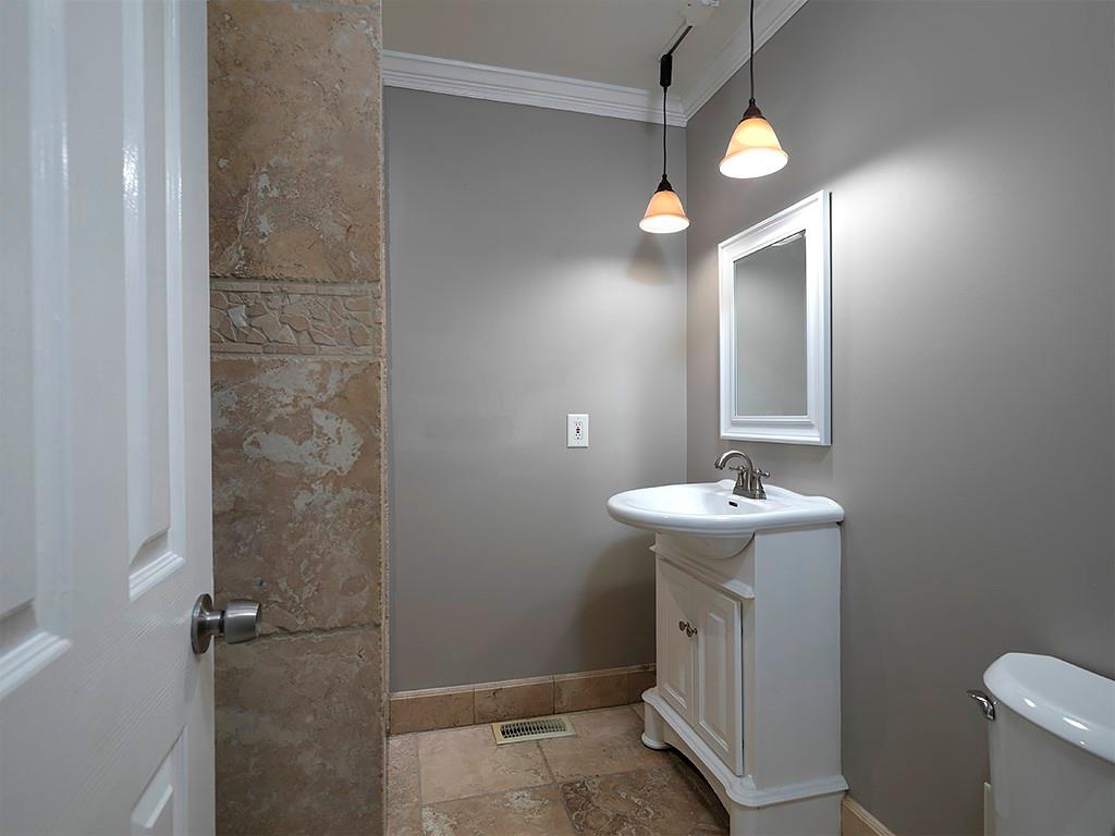 581 Autumn Lane Marietta, GA 30068 - Photo 23 of 28 a bathroom with a sink a toilet and mirror