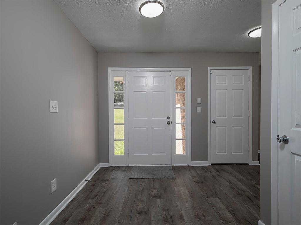 581 Autumn Lane Marietta, GA 30068 - Photo 5 of 28 an empty room with wooden floor and windows