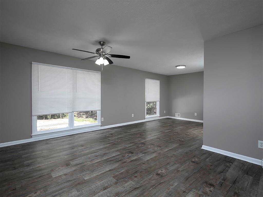 581 Autumn Lane Marietta, GA 30068 - Photo 6 of 28 an empty room with wooden floor and windows