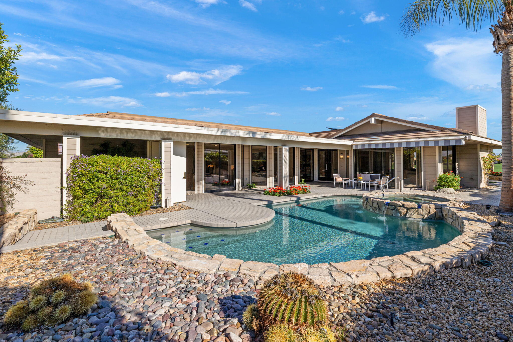 95 Mayfair Drive Rancho Mirage, CA 92270 - Photo 11 of 74 a view of a house with swimming pool and sitting area