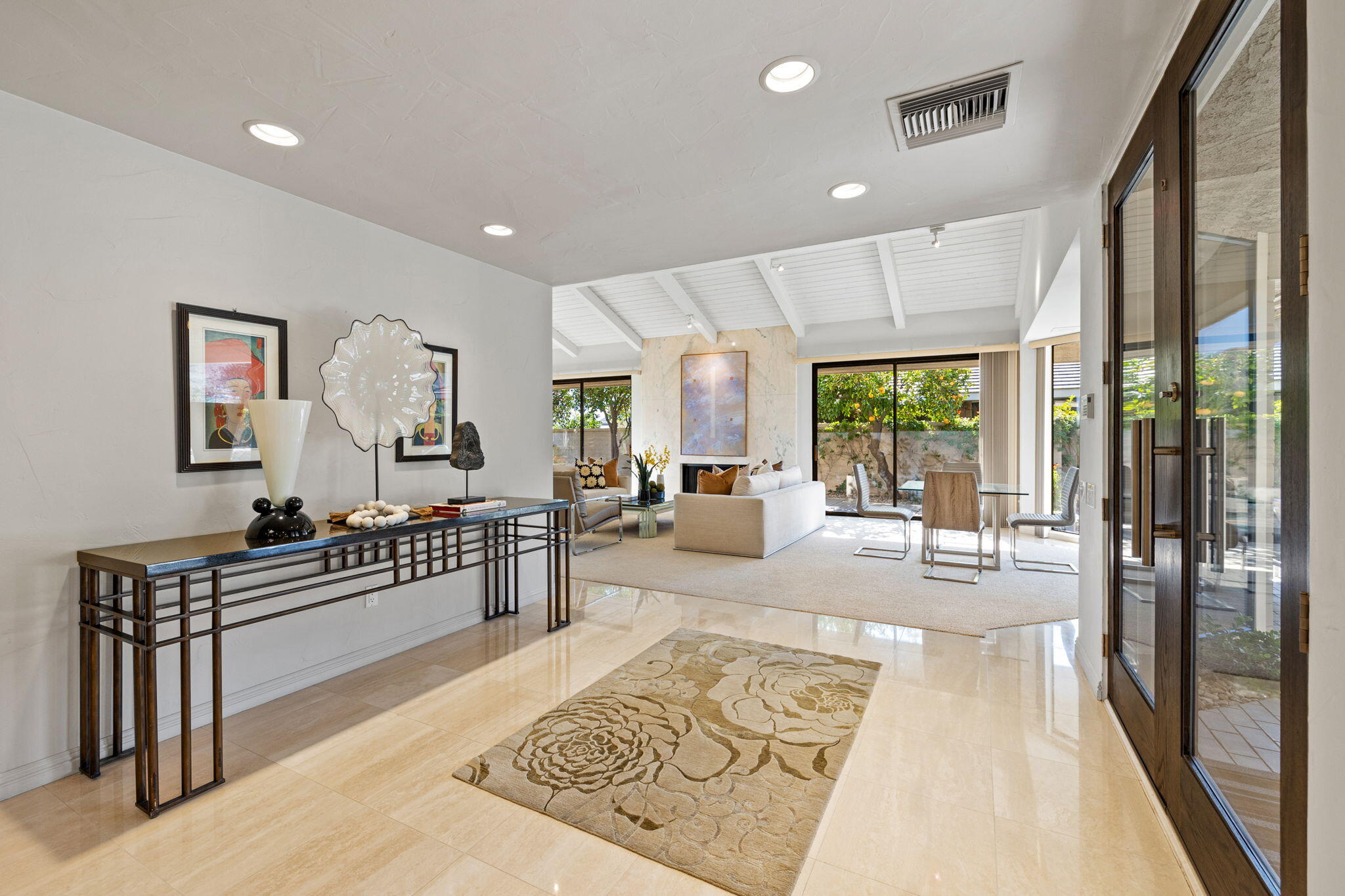 95 Mayfair Drive Rancho Mirage, CA 92270 - Photo 12 of 74 a living room with furniture a rug and a large window