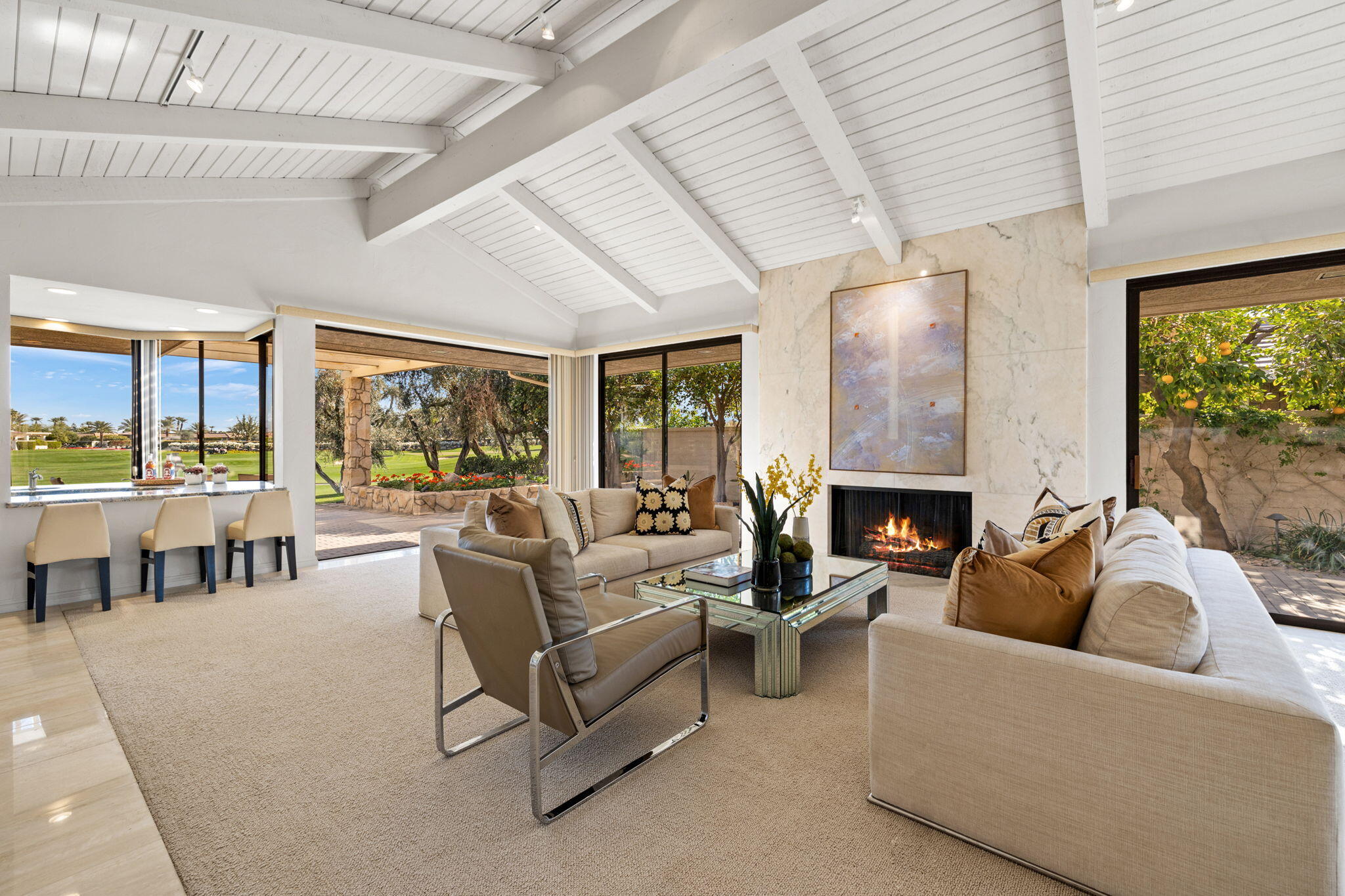 95 Mayfair Drive Rancho Mirage, CA 92270 - Photo 13 of 74 a living room with furniture and a fireplace
