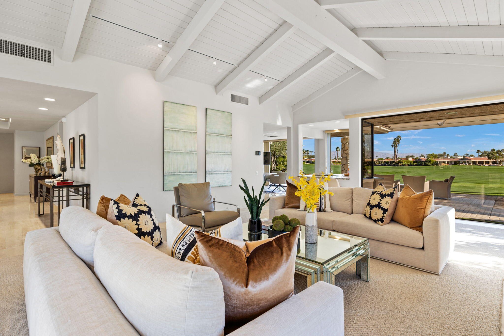 95 Mayfair Drive Rancho Mirage, CA 92270 - Photo 16 of 74 a living room with furniture and a large window