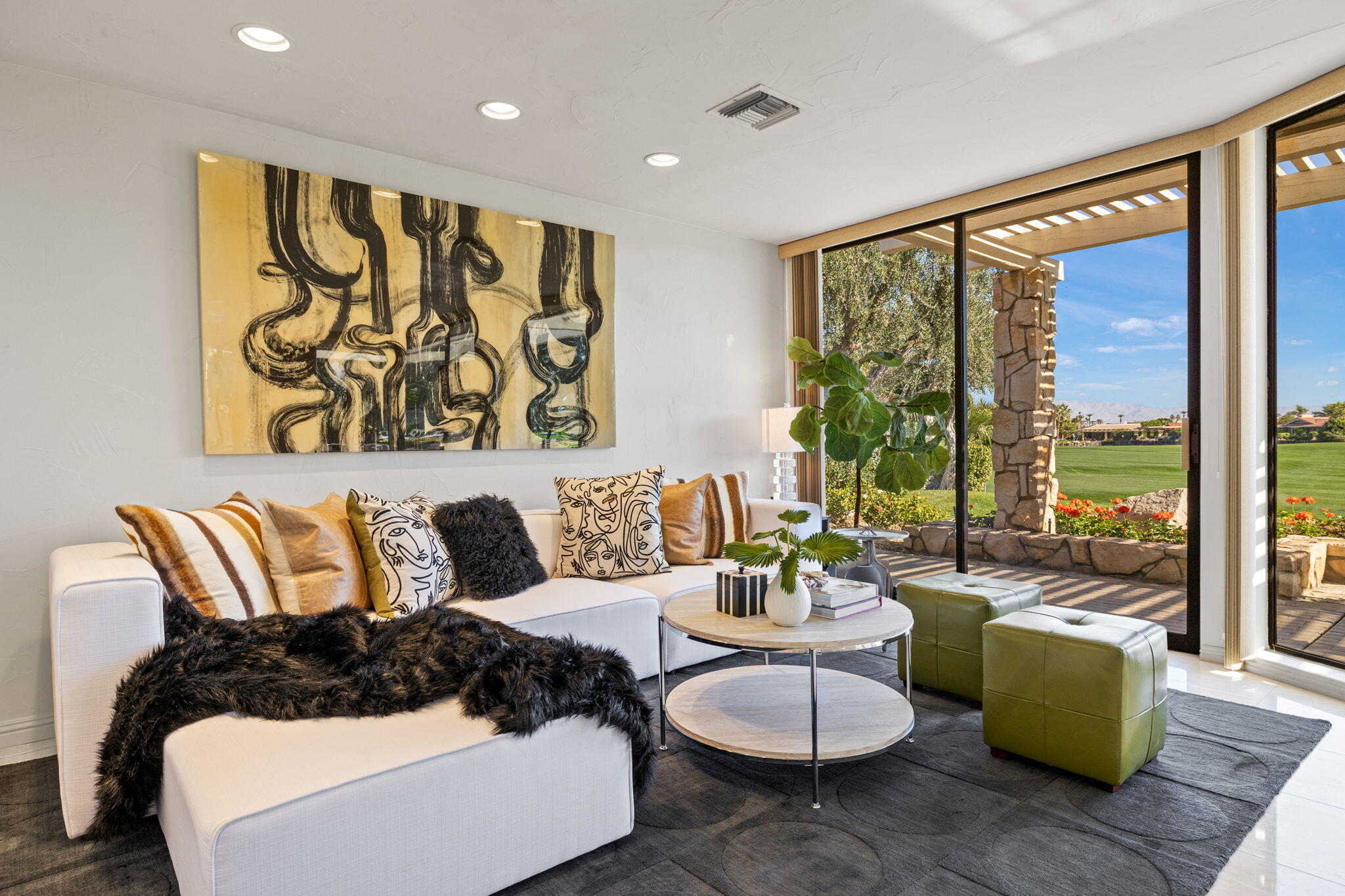 95 Mayfair Drive Rancho Mirage, CA 92270 - Photo 24 of 74 a living room with furniture and a large window