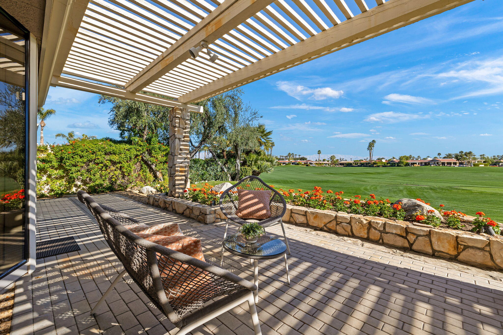 95 Mayfair Drive Rancho Mirage, CA 92270 - Photo 3 of 74 a view of a chairs and table on the terrace