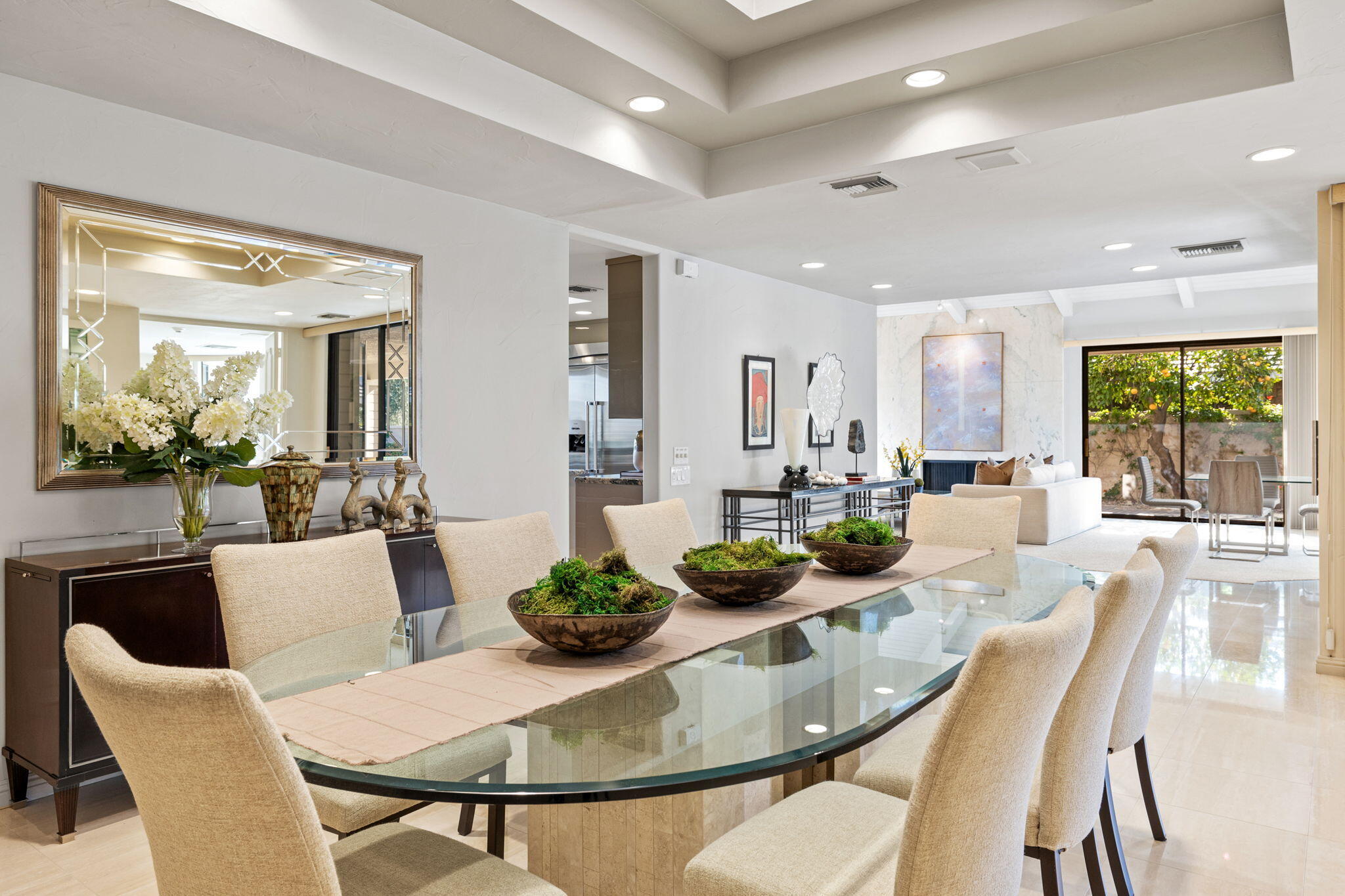 95 Mayfair Drive Rancho Mirage, CA 92270 - Photo 33 of 74 a view of a dining room with furniture and a potted plant