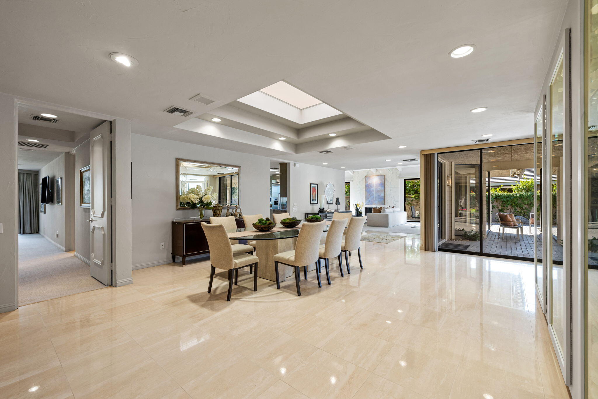 95 Mayfair Drive Rancho Mirage, CA 92270 - Photo 35 of 74 a dining hall with stainless steel appliances a dining table chairs and view kitchen