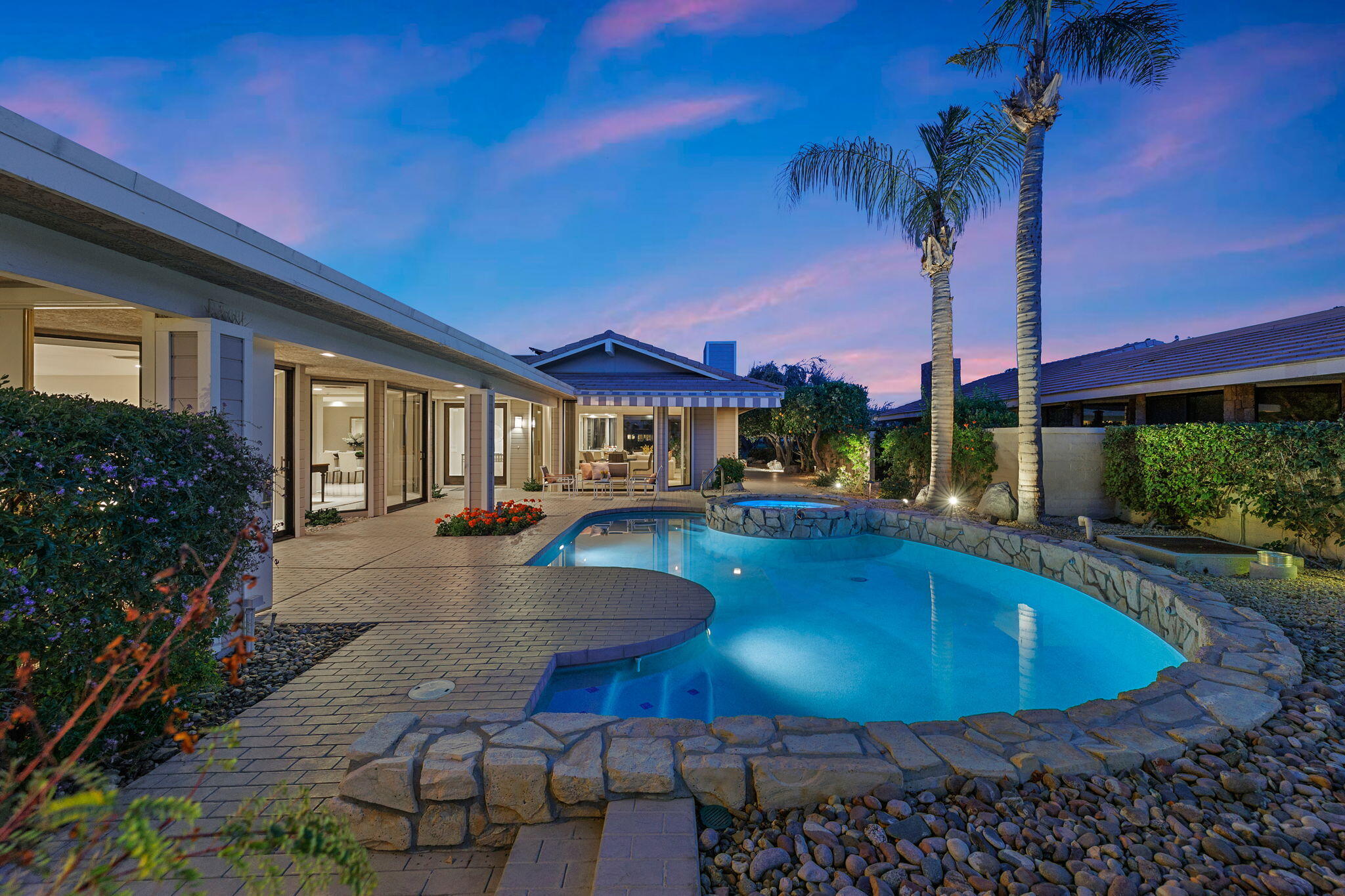 95 Mayfair Drive Rancho Mirage, CA 92270 - Photo 4 of 74 a view of a house with swimming pool yard patio and fire pit