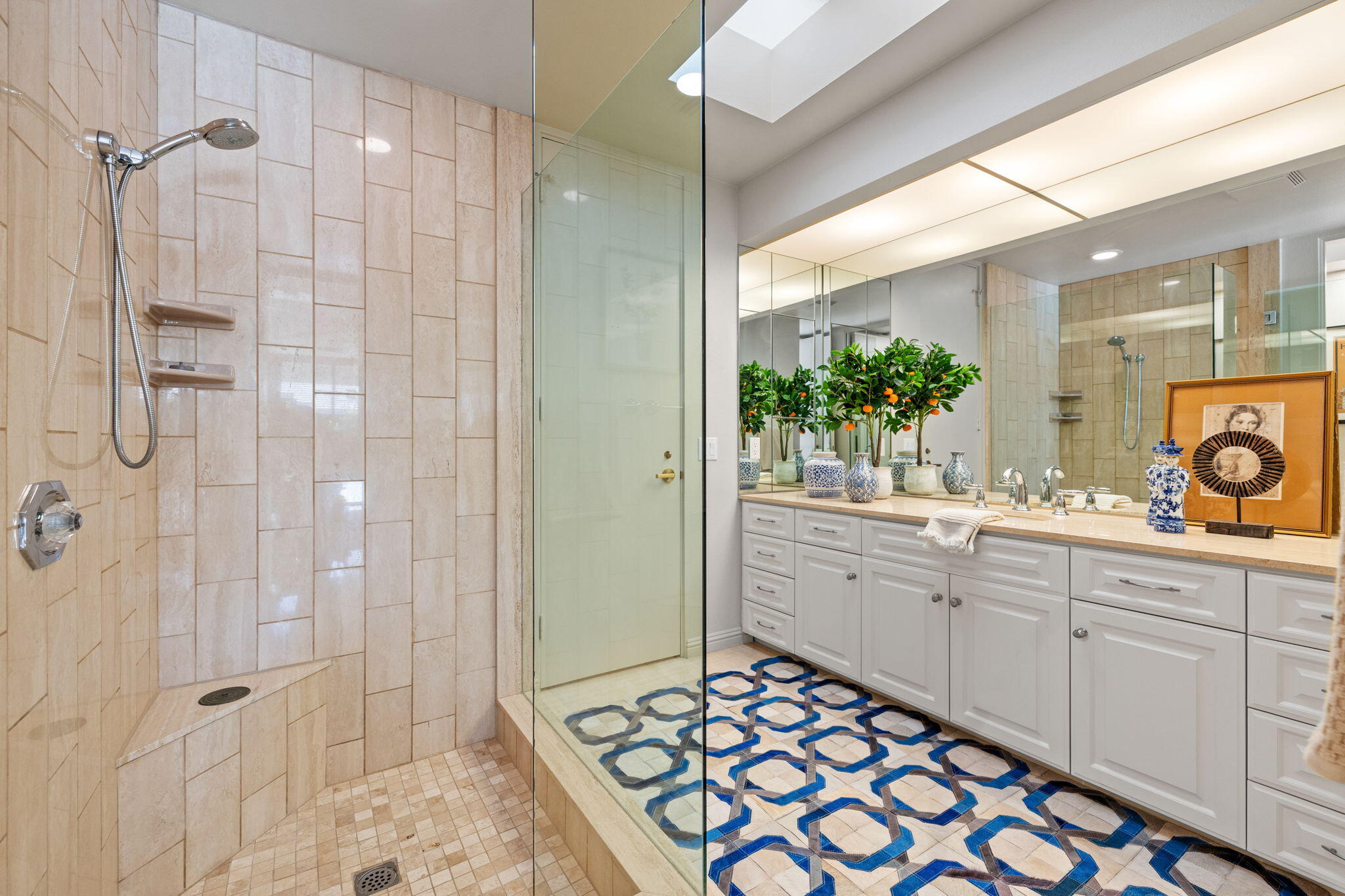 95 Mayfair Drive Rancho Mirage, CA 92270 - Photo 41 of 74 a spacious bathroom with a shower sink and mirror