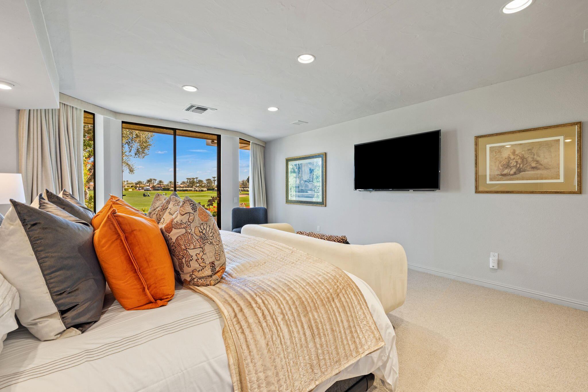 95 Mayfair Drive Rancho Mirage, CA 92270 - Photo 44 of 74 a bedroom with a bed and a flat screen tv
