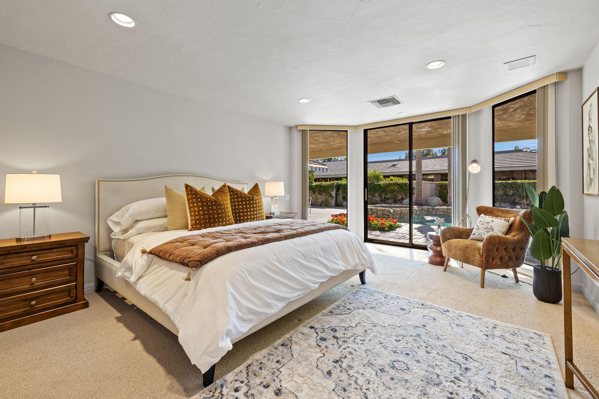 95 Mayfair Drive Rancho Mirage, CA 92270 - Photo 51 of 74 a bedroom with a large bed and a large window