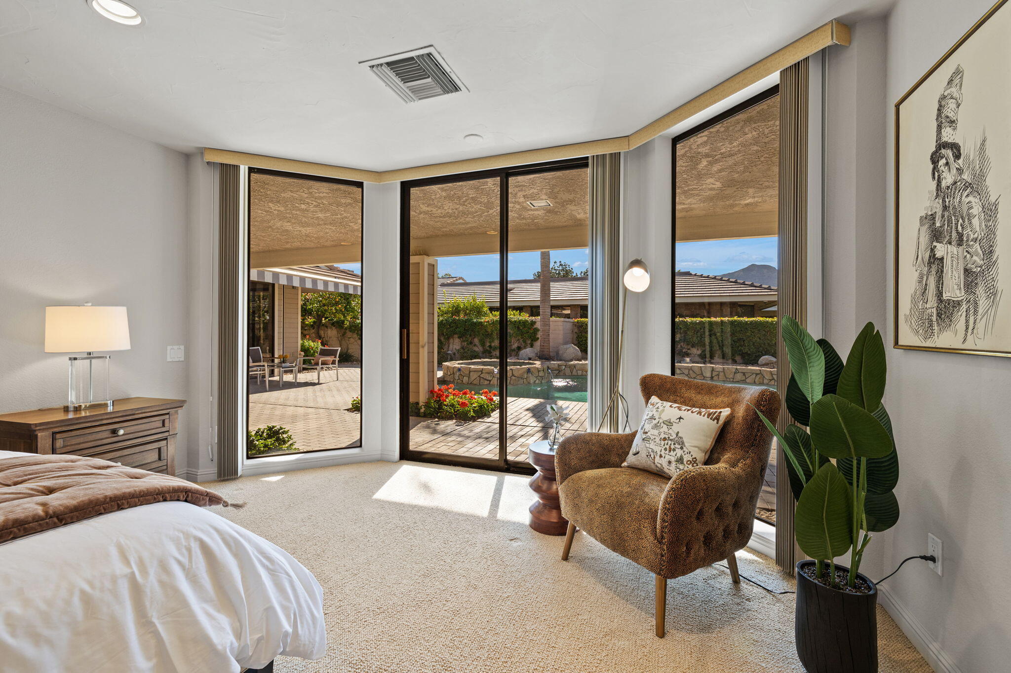 95 Mayfair Drive Rancho Mirage, CA 92270 - Photo 52 of 74 a bedroom with a large bed and a large window