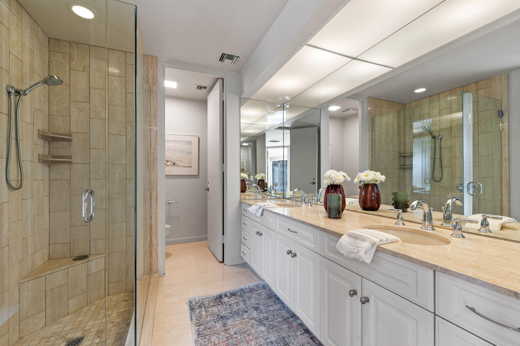 95 Mayfair Drive Rancho Mirage, CA 92270 - Photo 53 of 74 a bathroom with a double vanity sink mirror and shower