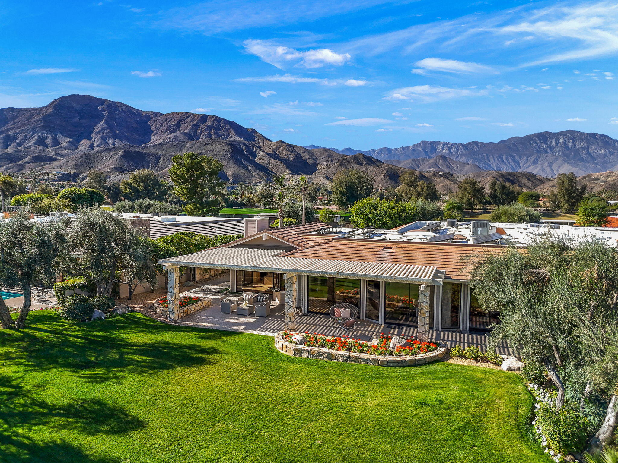 95 Mayfair Drive Rancho Mirage, CA 92270 - Photo 54 of 74 a view of house with swimming pool and mountains in the background