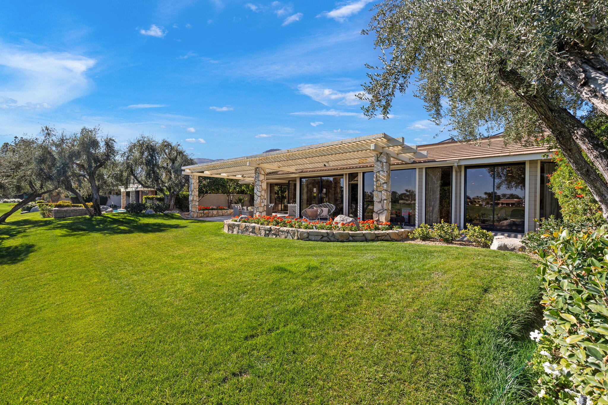 95 Mayfair Drive Rancho Mirage, CA 92270 - Photo 55 of 74 a view of a house with a yard patio and swimming pool
