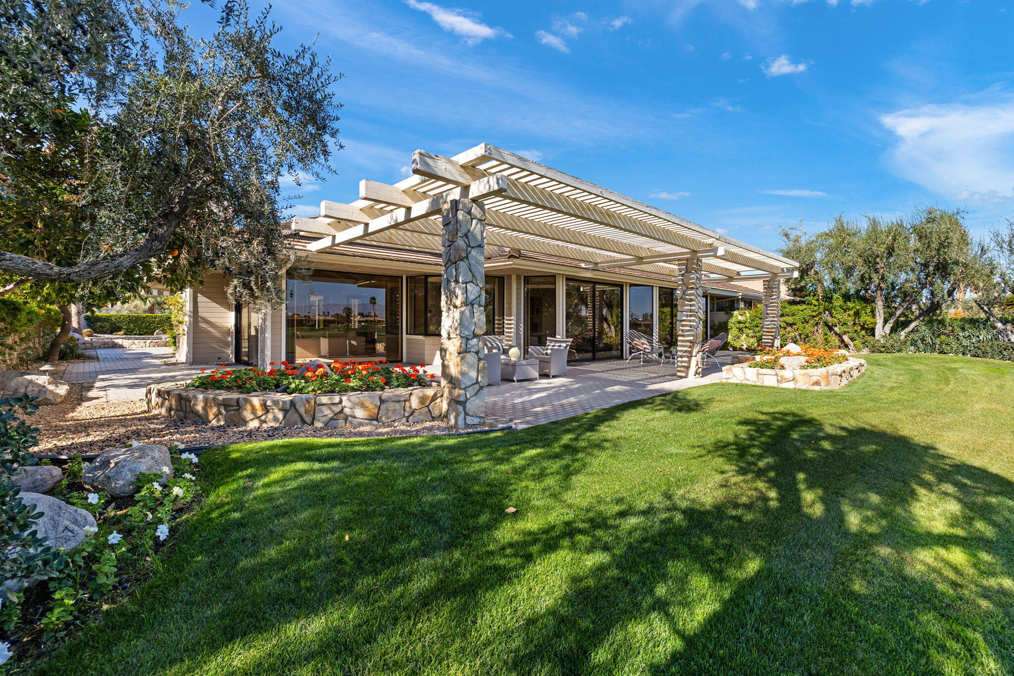 95 Mayfair Drive Rancho Mirage, CA 92270 - Photo 56 of 74 a view of a house with backyard porch and sitting area