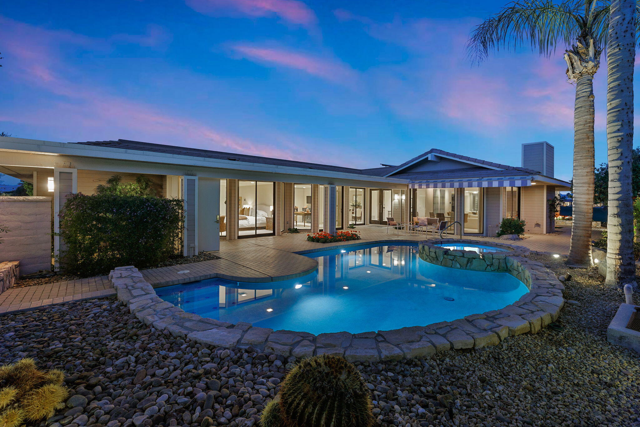 95 Mayfair Drive Rancho Mirage, CA 92270 - Photo 64 of 74 a view of a house with swimming pool and porch with furniture