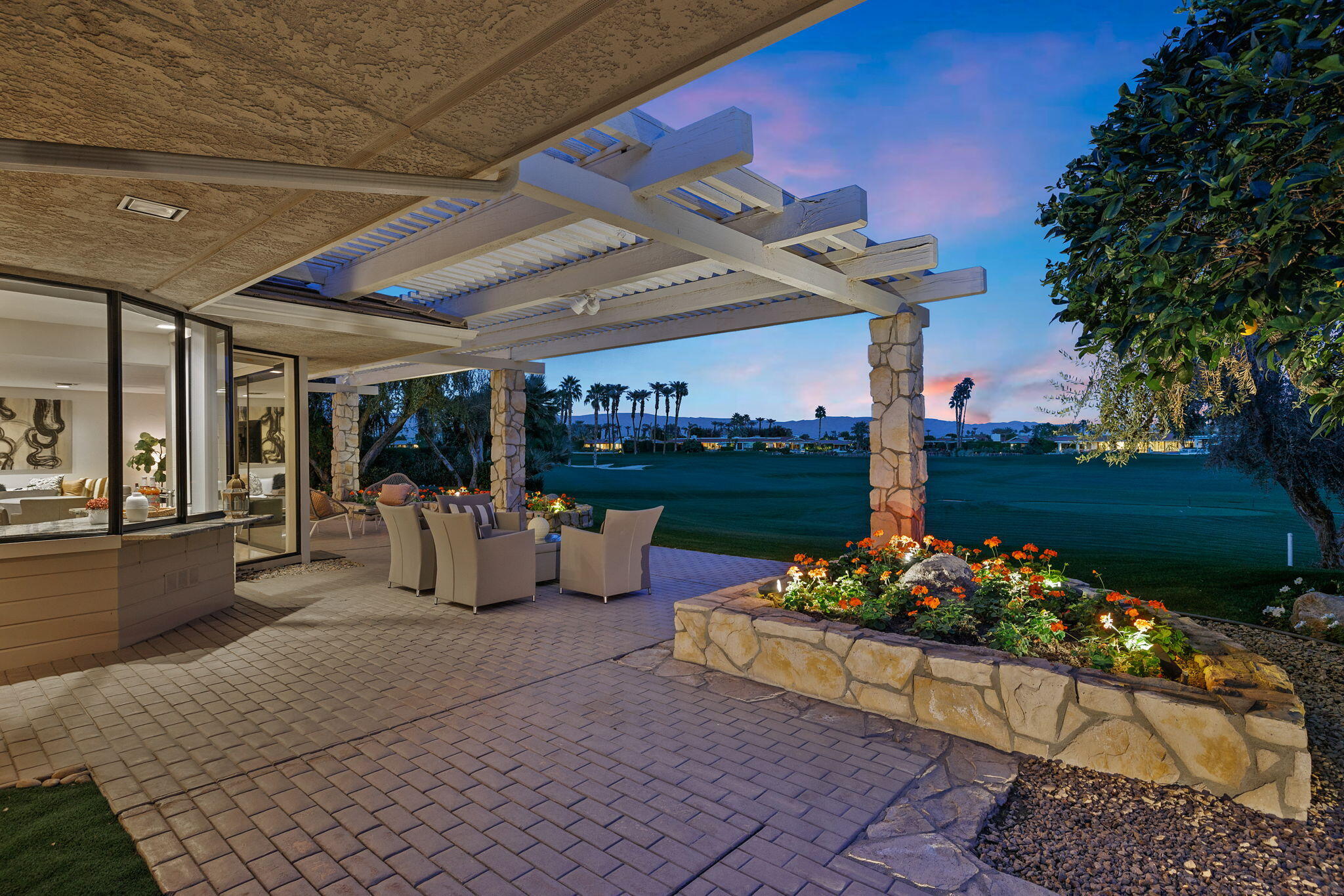 95 Mayfair Drive Rancho Mirage, CA 92270 - Photo 65 of 74 a outdoor living space with furniture and a garden