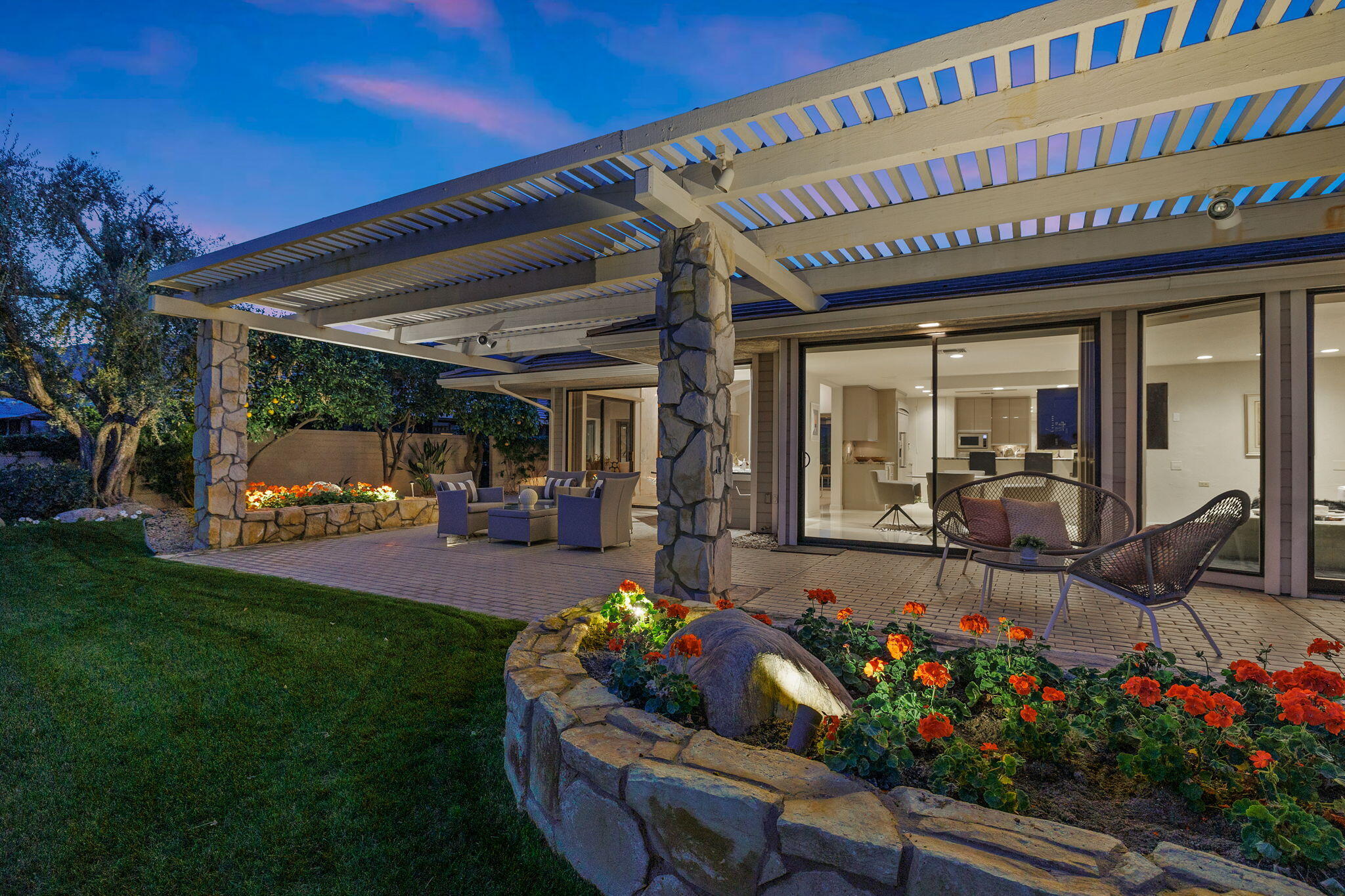95 Mayfair Drive Rancho Mirage, CA 92270 - Photo 66 of 74 a front view of a house with a porch and garden