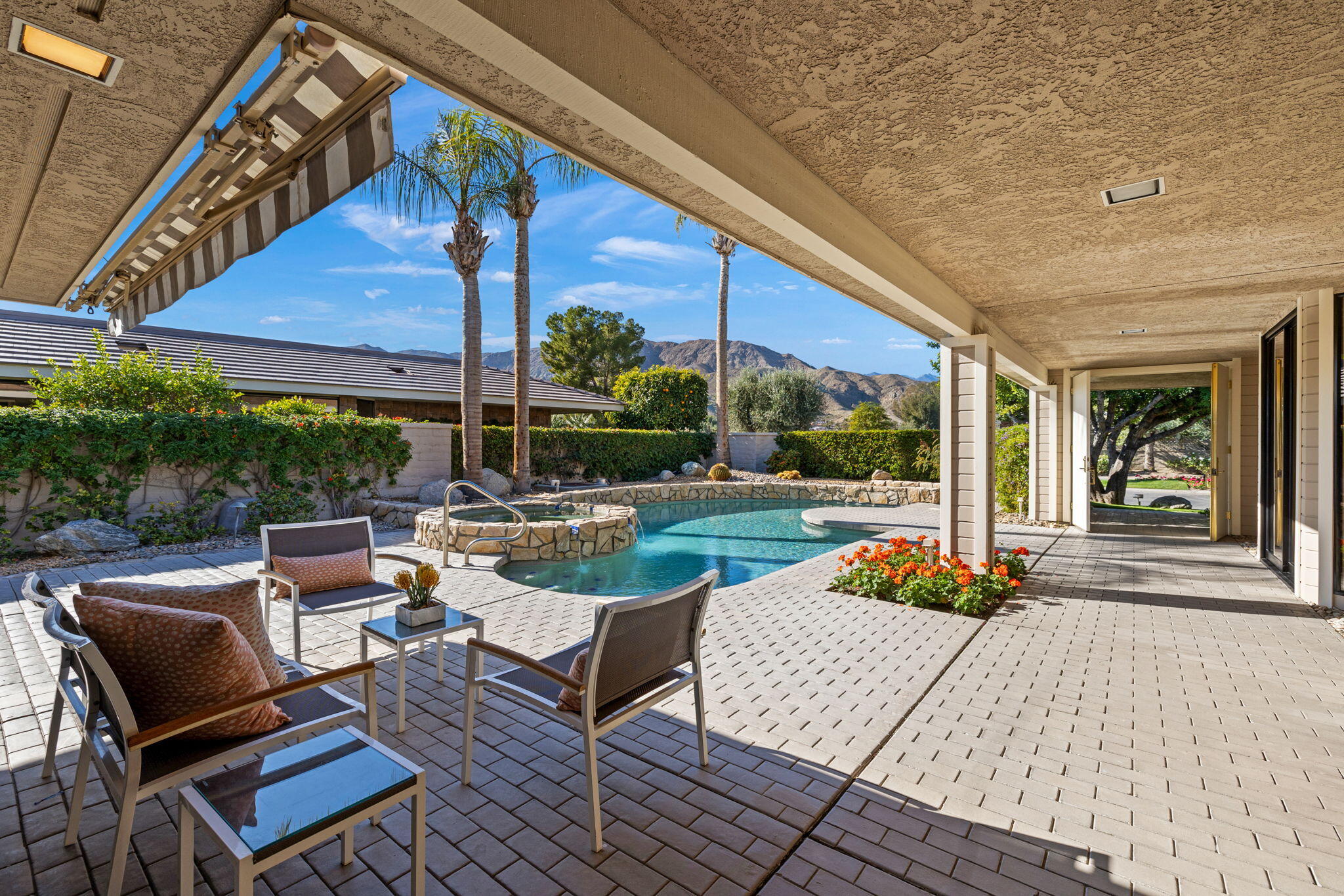 95 Mayfair Drive Rancho Mirage, CA 92270 - Photo 8 of 74 a view of a patio with table and chairs and potted plants