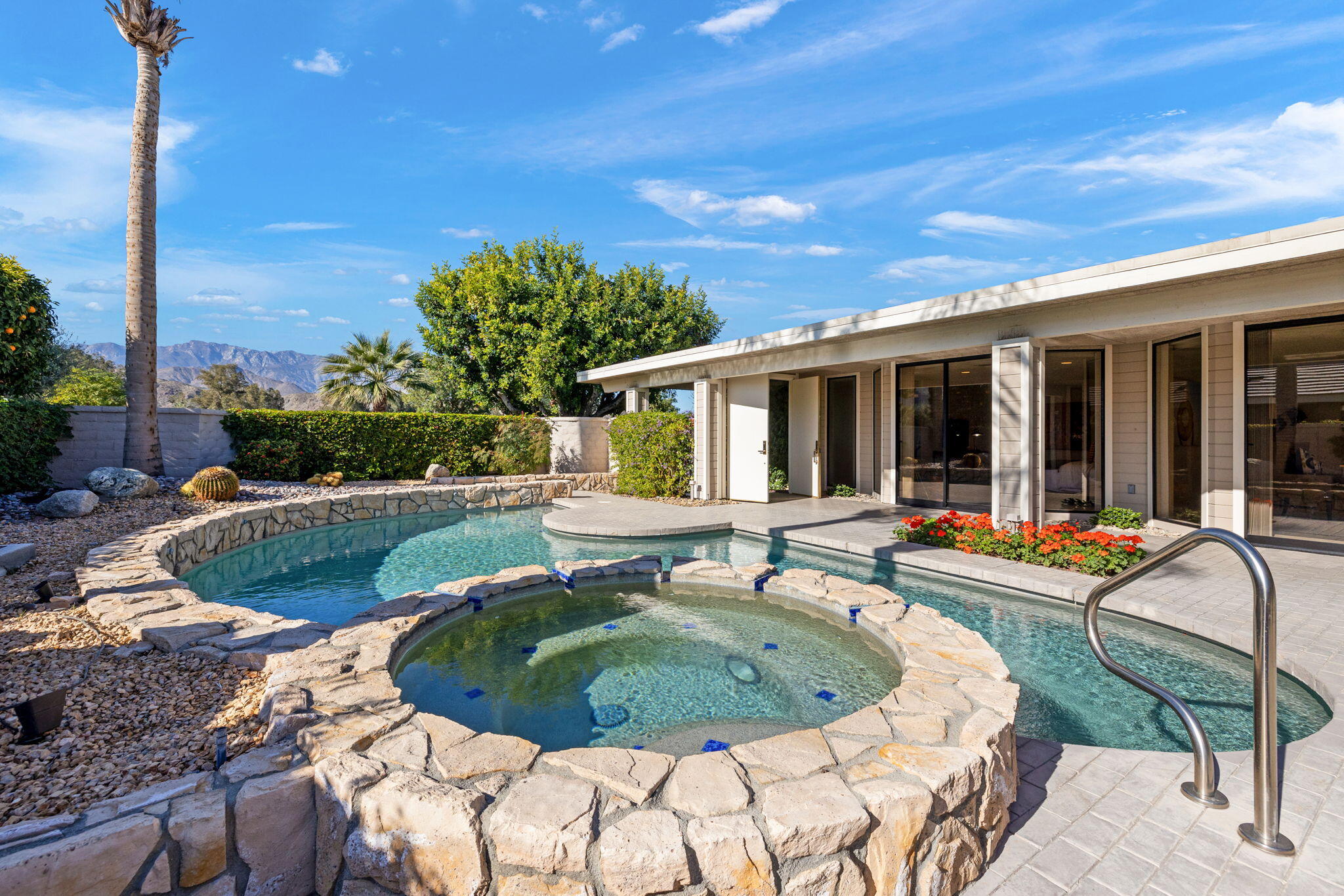95 Mayfair Drive Rancho Mirage, CA 92270 - Photo 9 of 74 a view of a house with swimming pool and sitting area