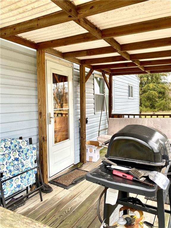 636 Fallen Timbers Road Point Marion, PA 15474 - Photo 5 of 21 a backyard of a house with barbeque oven table and chairs