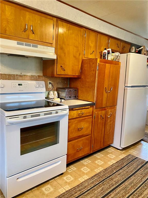 636 Fallen Timbers Road Point Marion, PA 15474 - Photo 10 of 21 a kitchen with a white cabinets and white appliances