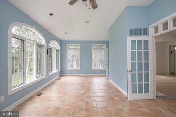 a kitchen with stainless steel appliances granite countertop white cabinets and refrigerator