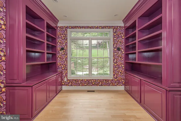 a view of a room with rack on the wall and a window