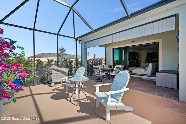 a view of a dining tables and chairs in patio