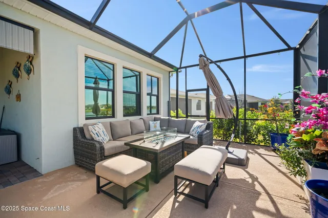 a living room with furniture and flowers
