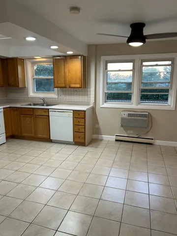 a kitchen with a sink and a microwave