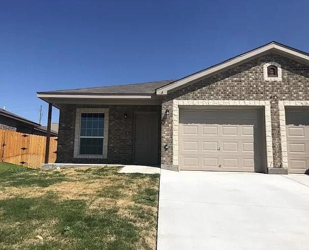 403 Olaf Drive, Unit B Temple, TX 76504 - Photo 1 of 1 a front view of a house with a yard