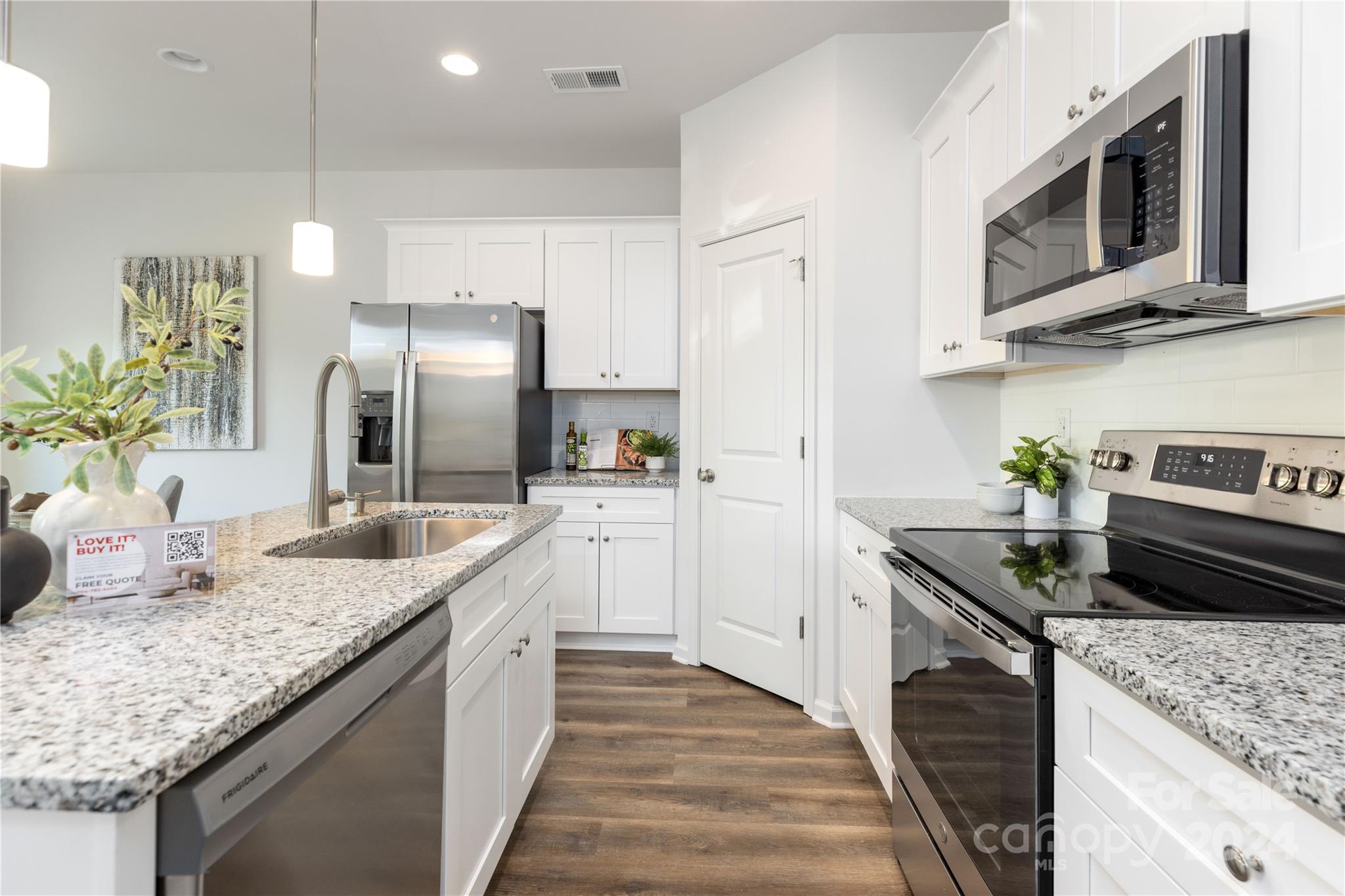 312 Morningside Road Charlotte, NC 28214 - Photo 2 of 23 a kitchen with stainless steel appliances granite countertop a sink a stove and a refrigerator