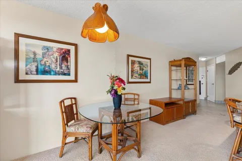 a view of a dining room with furniture window and outside view