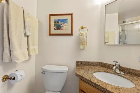 a bathroom with a shower and a mirror