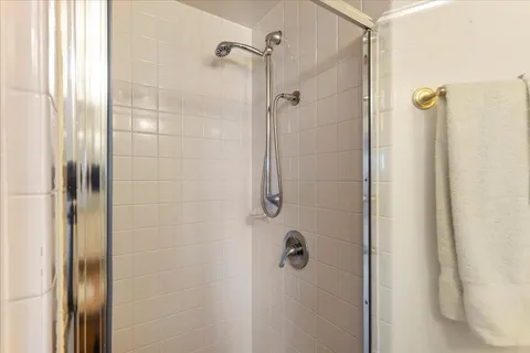 an aerial view of residential houses with city view