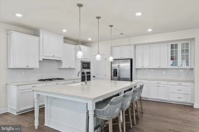 a bathroom with double sink and a mirror