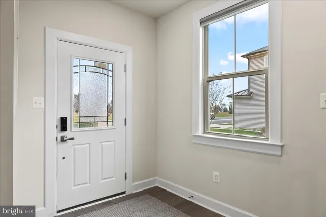 a living room with furniture wooden floor and a flat screen tv