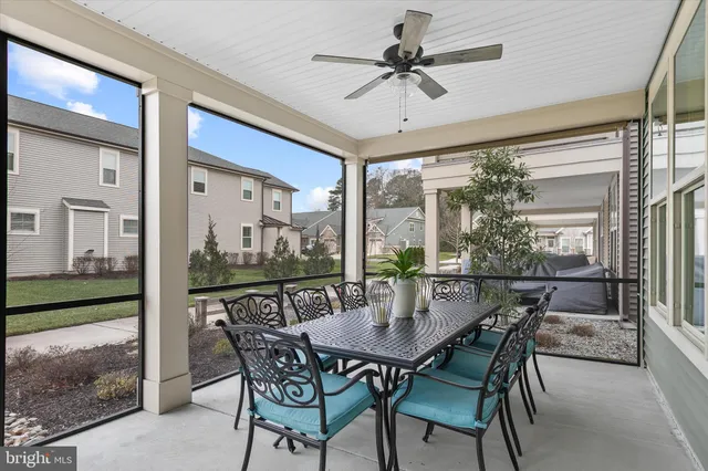 a view of a chair and tables in the balcony