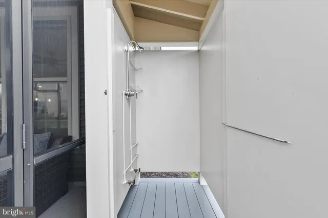 a front view of a house with a garden and plants