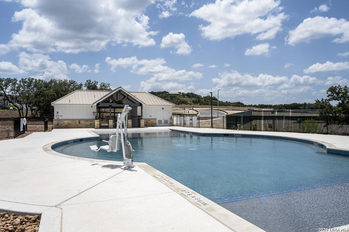 149 Local Wave Drive Boerne, TX 78006 - Photo 5 of 9 a view of a swimming pool with a yard