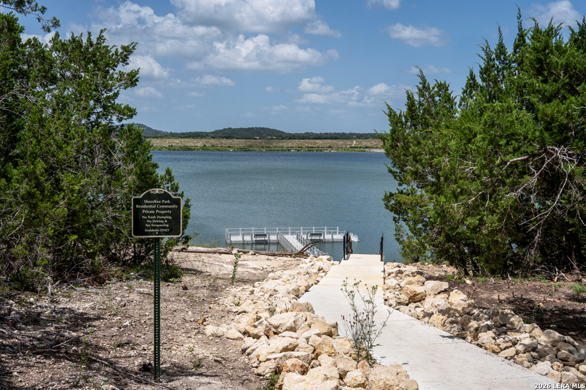 149 Local Wave Drive Boerne, TX 78006 - Photo 8 of 9 a view of a lake with a mountain