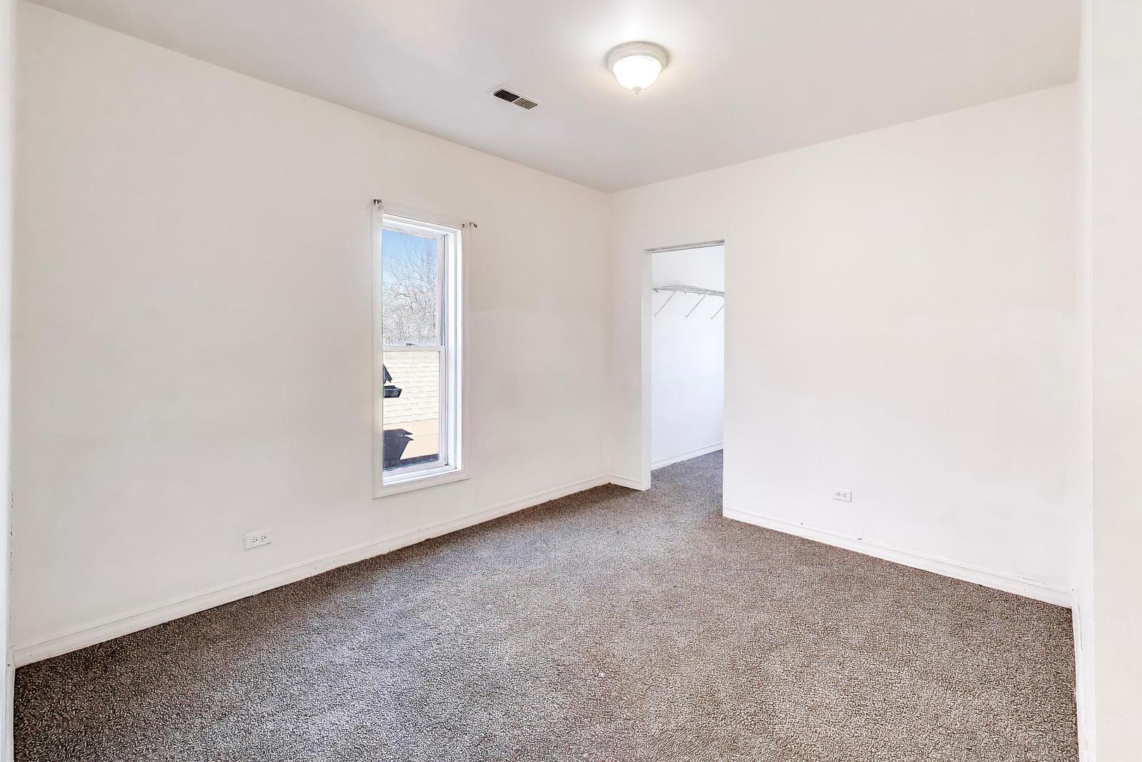 6853 South Perry Avenue Chicago, IL 60621 - Photo 19 of 28 an empty room with windows