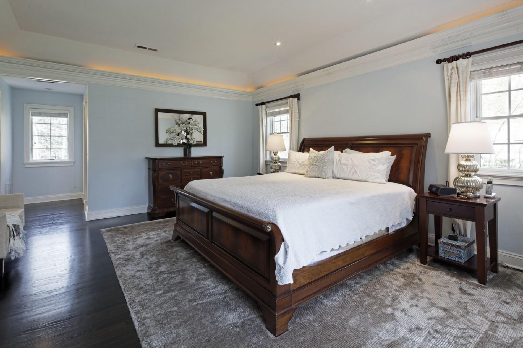 35 Hamilton Lane Darien, CT 06820 - Photo 14 of 25 a large bedroom with a bed and wooden floor