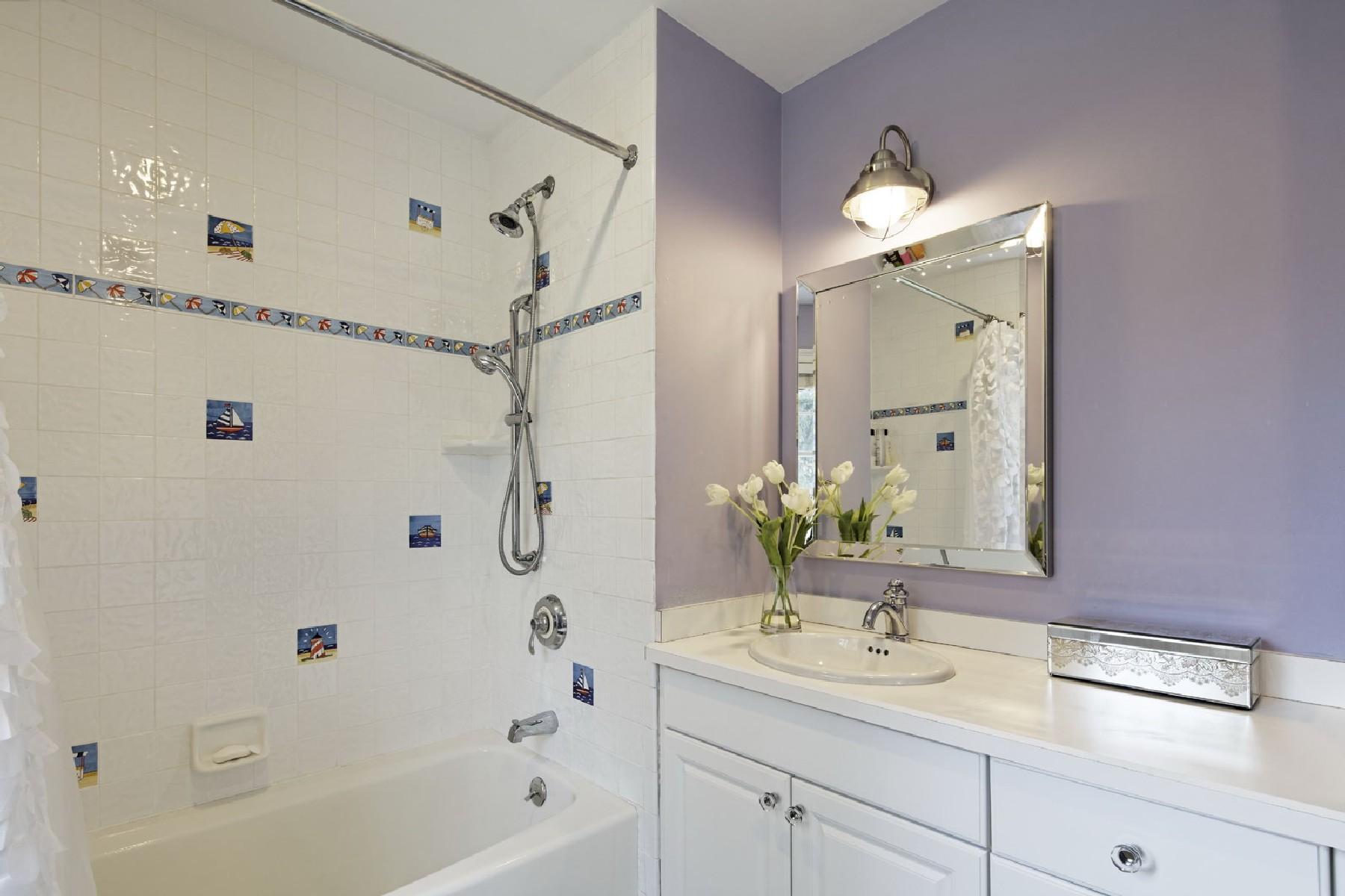 35 Hamilton Lane Darien, CT 06820 - Photo 17 of 25 a bathroom with a granite countertop sink a shower and a mirror