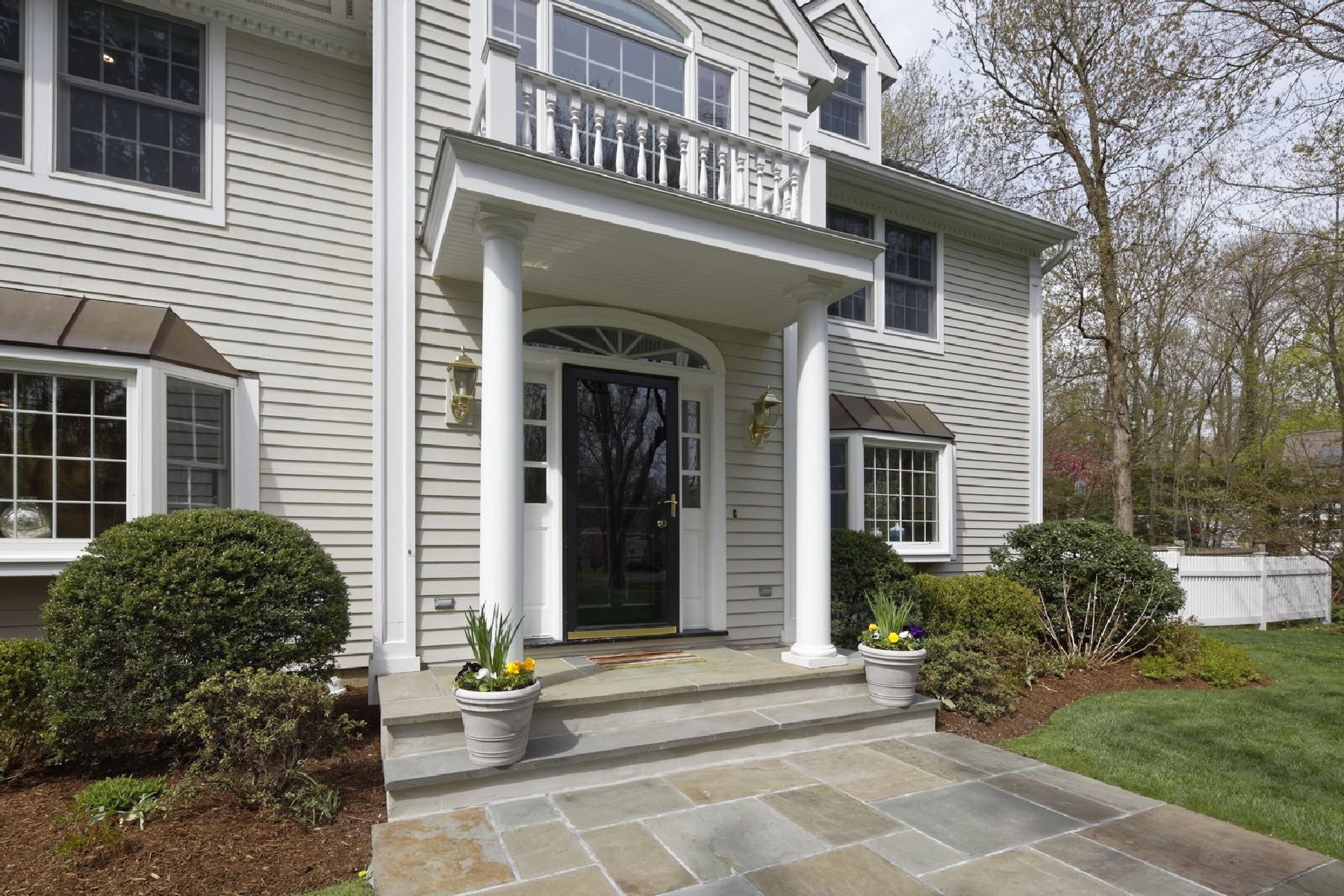 35 Hamilton Lane Darien, CT 06820 - Photo 23 of 25 a view of a brick house with a patio