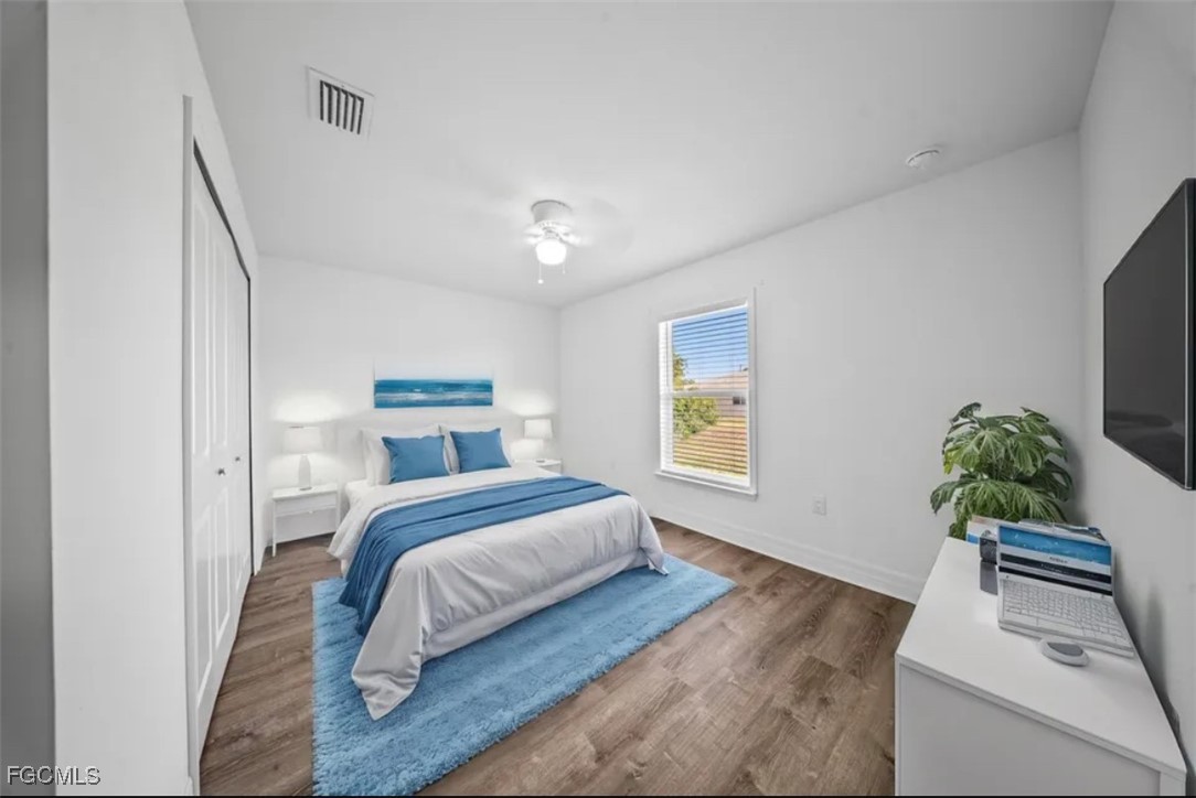 4414 28th Street Southwest Lehigh Acres, FL 33973 - Photo 12 of 29 a bedroom with a bed and a couch