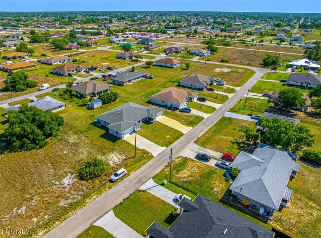 4414 28th Street Southwest Lehigh Acres, FL 33973 - Photo 24 of 29 an aerial view of residential houses with outdoor space